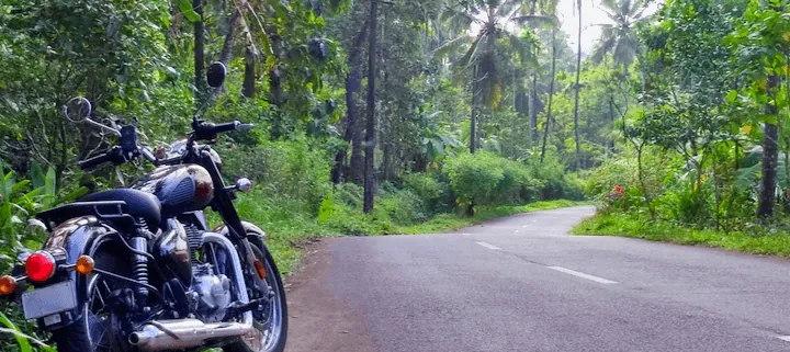 Royal Enfield Classic 350 Bike on Jungle Street, Kerala - guided motorcycle tours India